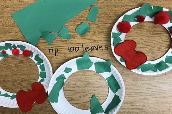 Paper plate with torn paper strips wreath