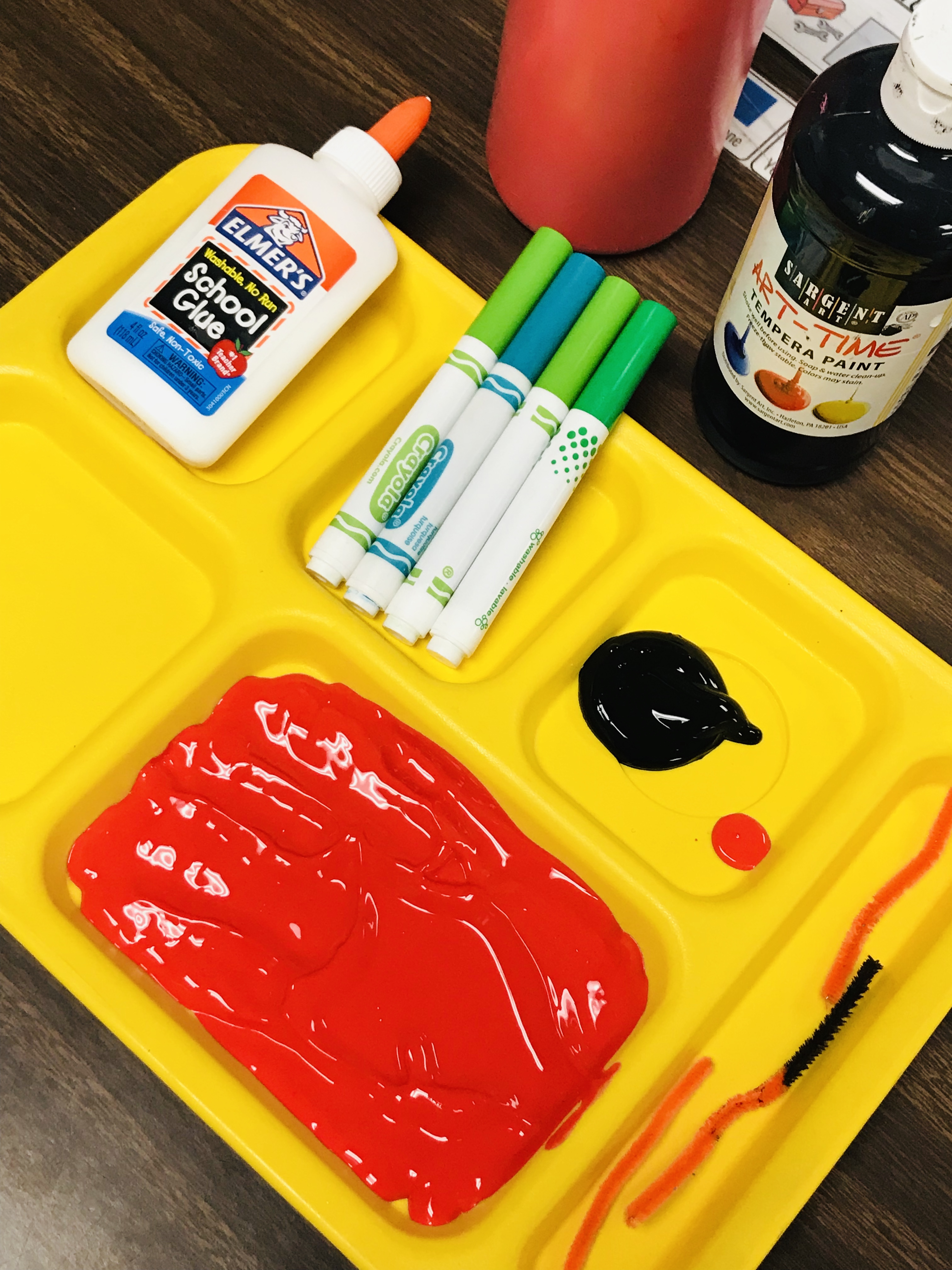 Food tray containing paint, markers and glue