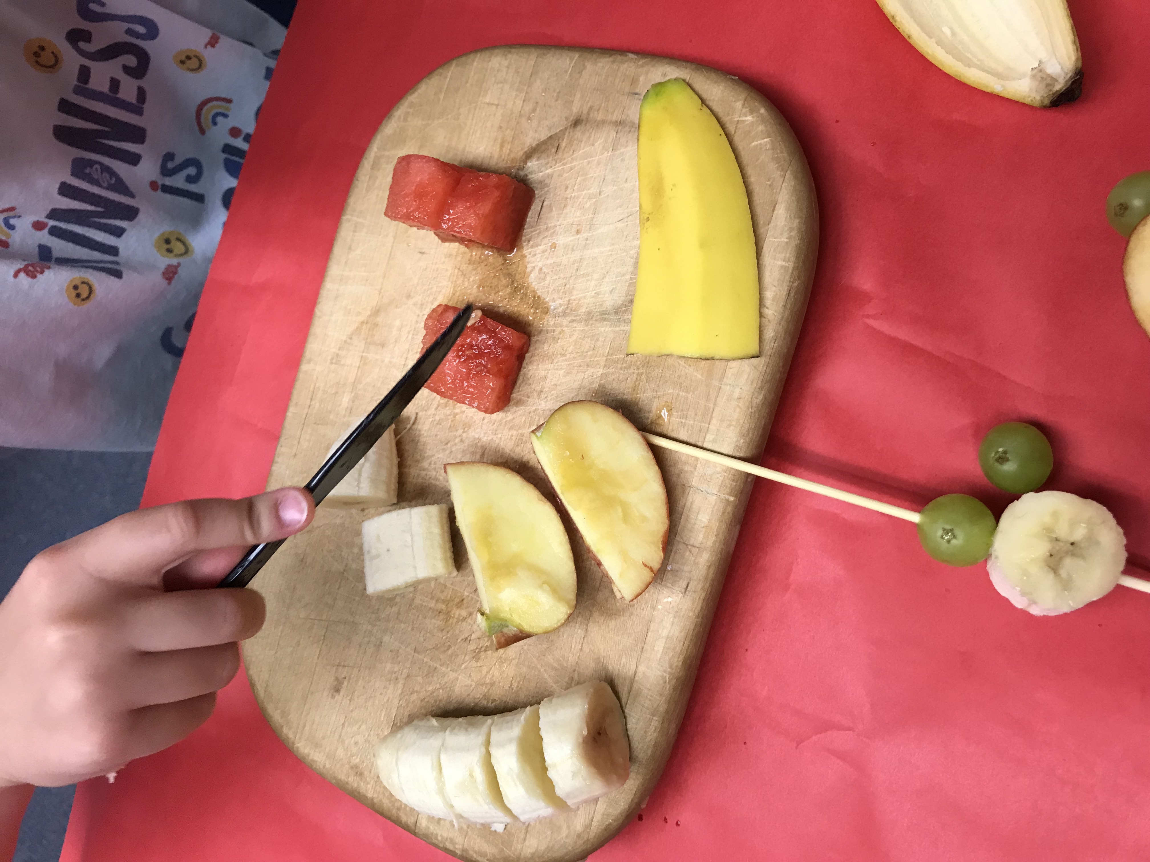 Cutting fruit on cutting board