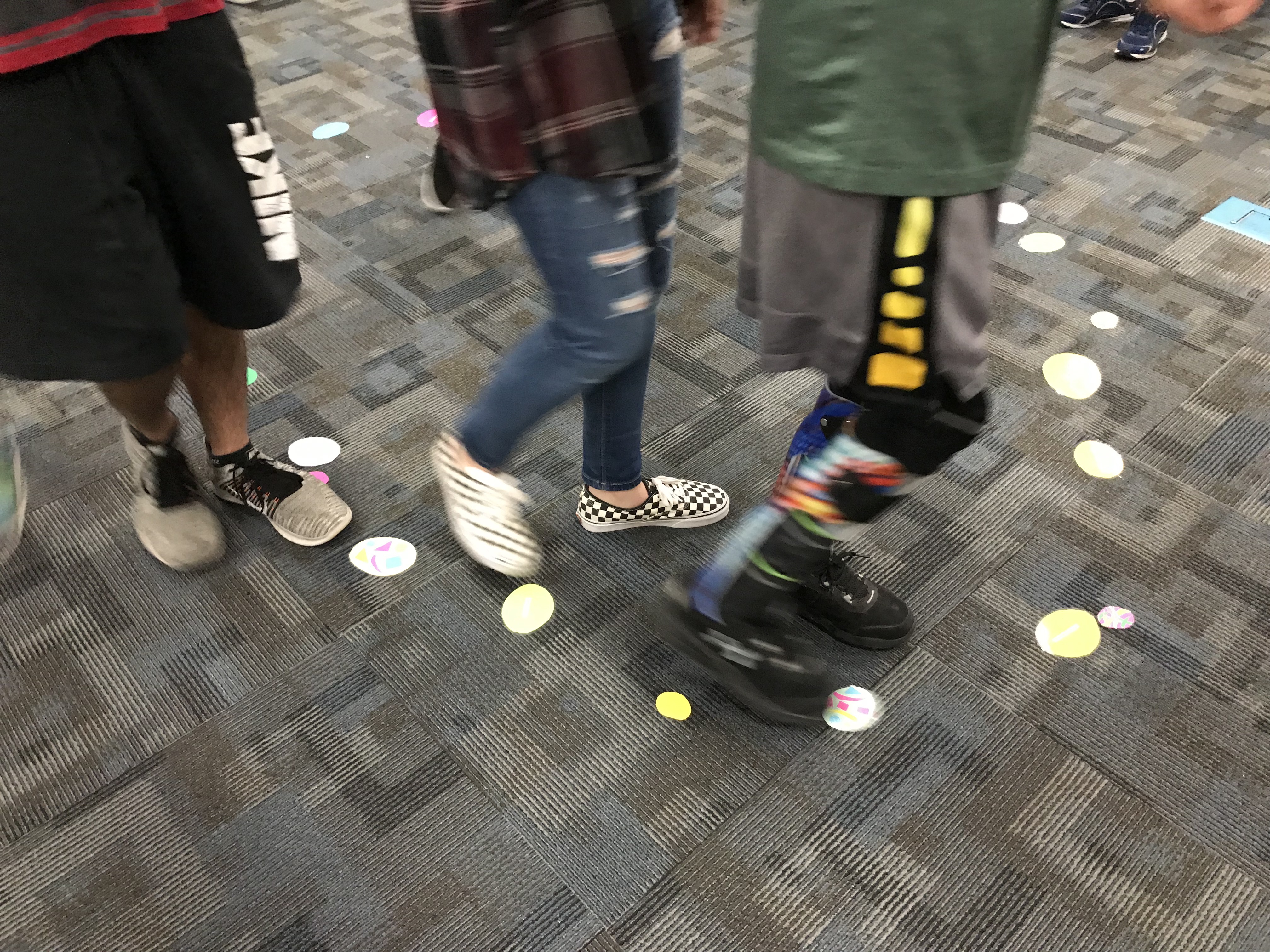 Kids following circles placed on carpet