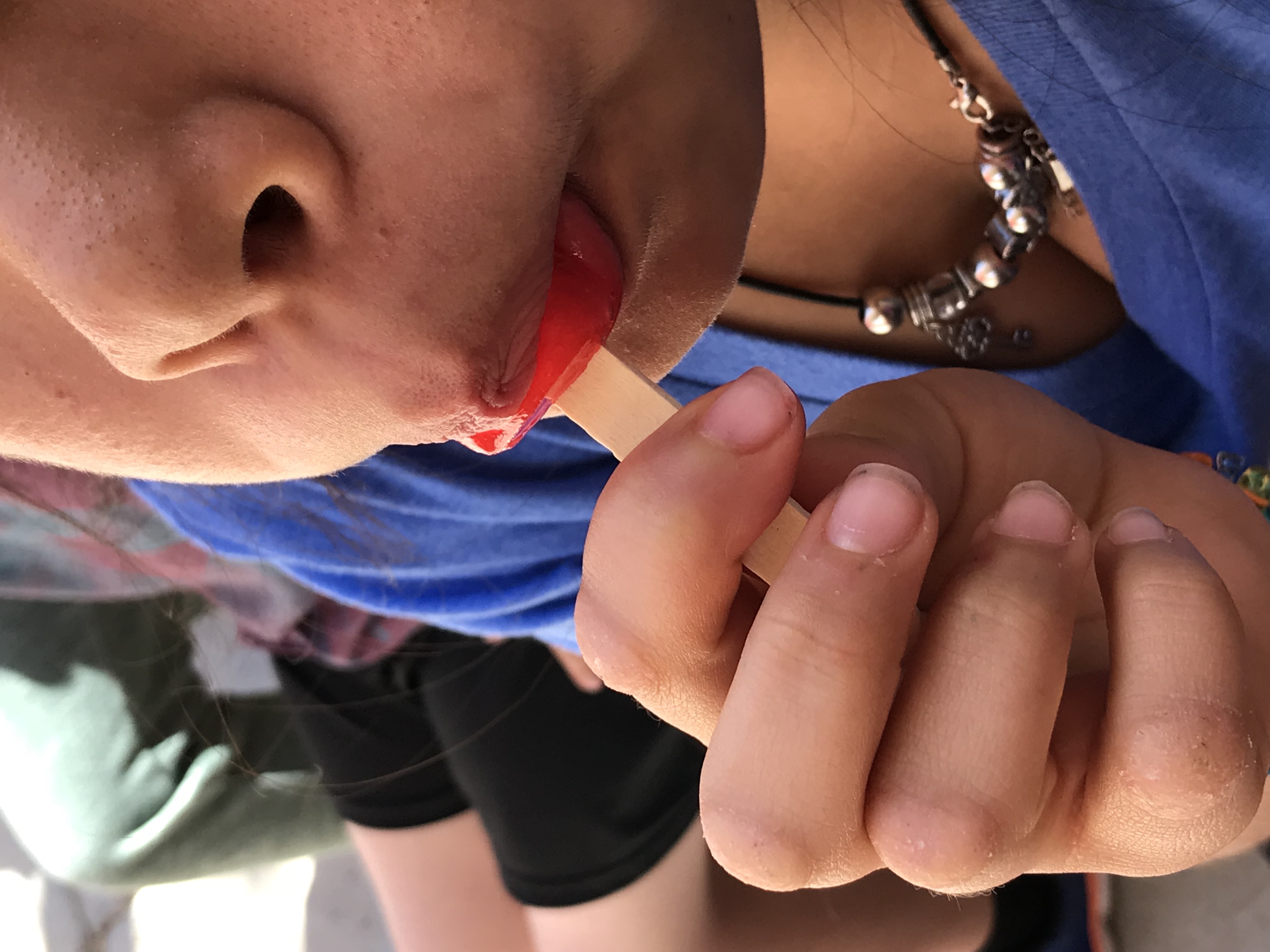 Kid eating popsicle