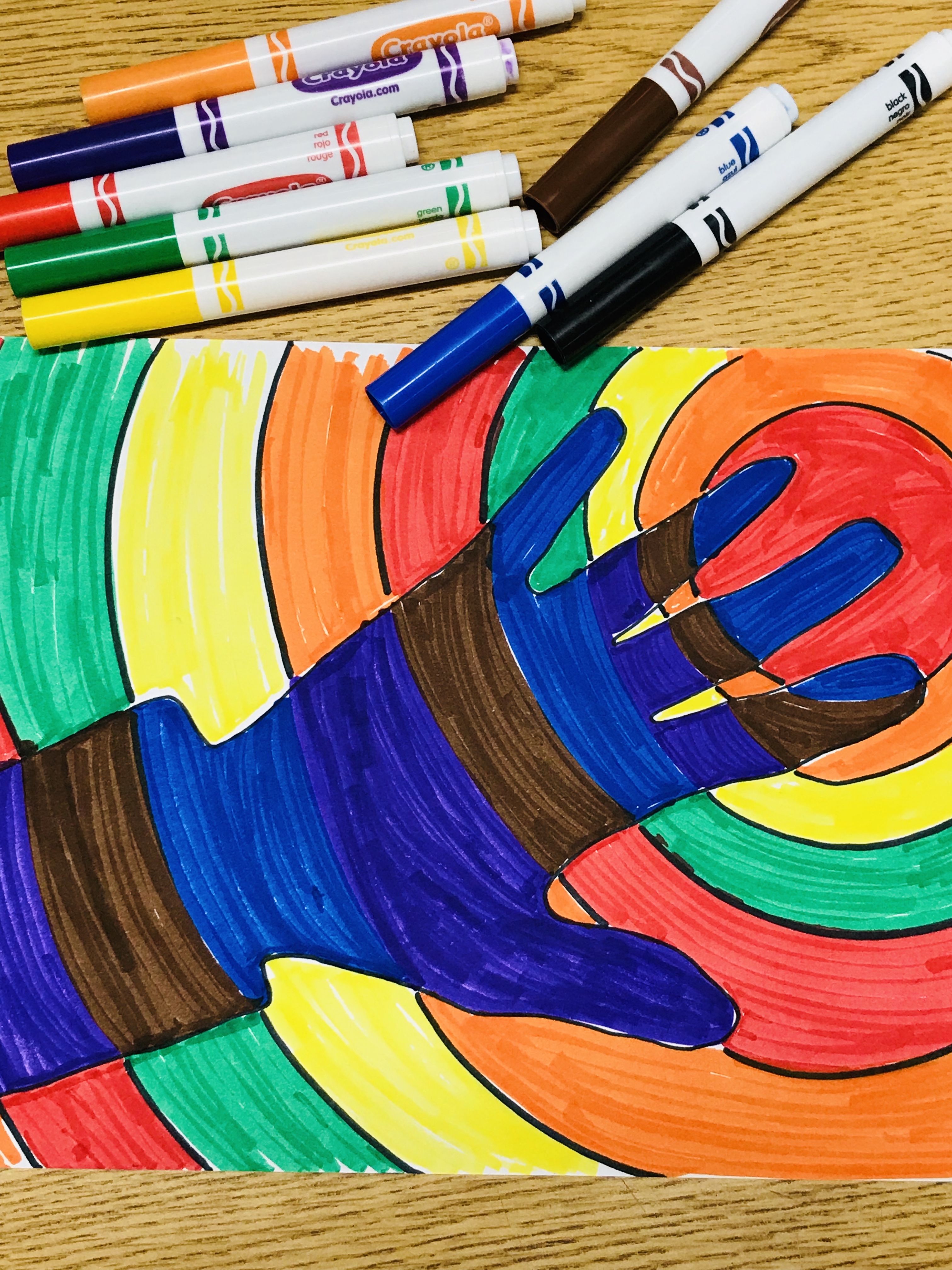 Rainbow colored hand print